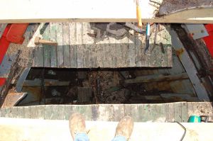 repairing the deck of a wooden trawler conversion fishing boat