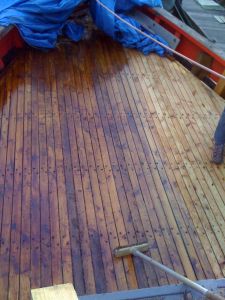 oiled wooden boat deck prior to caulking